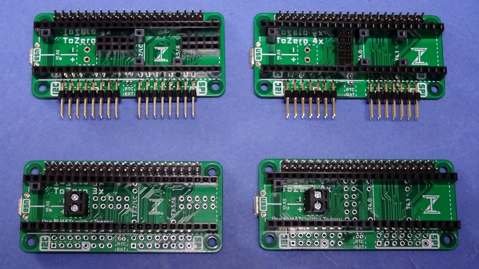 Four ToZero boards with different combinations of headers soldered